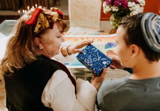 Mother Giving Gift to Her Son