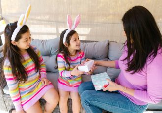 Mother Giving Gifts to Her Daughters