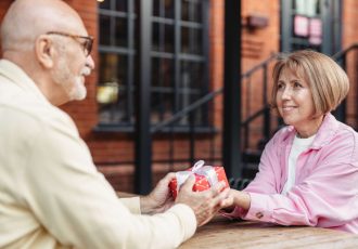 Man Giving a Present to a Women